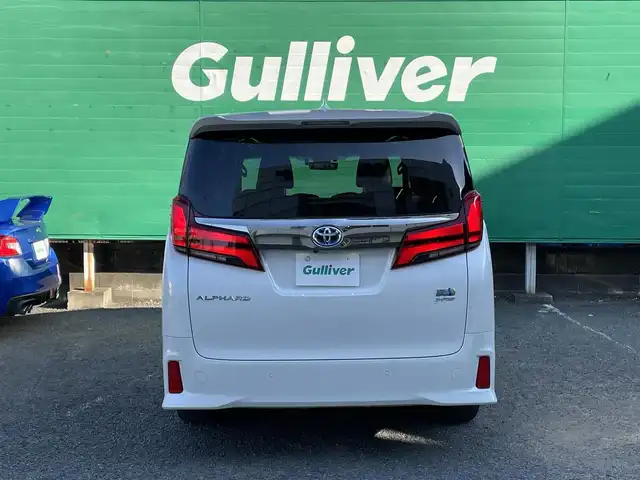 トヨタ アルファードハイブリット S タイプゴールドⅡ 東京都 2021(令3)年 1.7万km ホワイトパールクリスタルシャイン ワンオーナー/純正ナビ/・フルセグTV/Bluetooth/DVD/Tコネクト/JBLプレミアムサウンド/ツインムーンルーフ/フリップダウンモニター/デジタルインナーミラー/パノラミックビューモニター/両側電動スライドドア/電動リアゲート/純正ドライブレコーダー（DRD-H68)/セーフティセンス/レーダークルーズコントロール/レーンキープアシスト/衝突軽減システム/前後コーナーセンサー/LEDライト/フロントフォグランプ/オートハイビーム/オットマン/スペアキー×1/ETC2.0/保証書/取扱説明書/記録簿