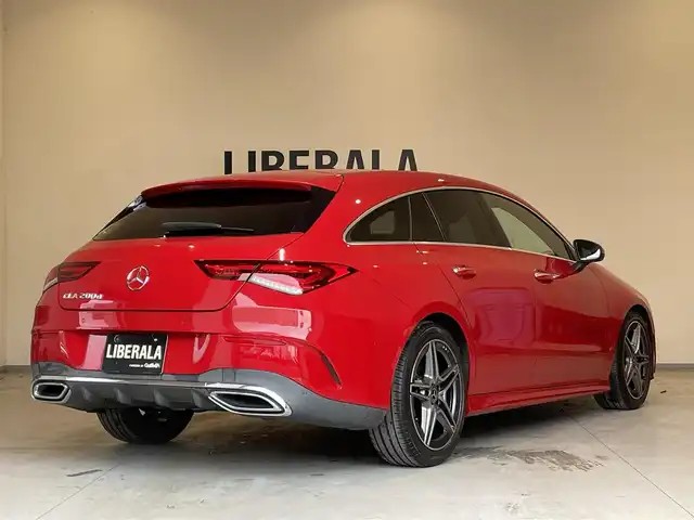 メルセデス・ベンツ ＣＬＡ２００ｄ Sブレーク AMGライン 熊本県 2020(令2)年 3.3万km ジュピターレッド ・スマートキー/・プッシュスタート/・アクティブステアリングアシスト/・道路標識アシスト/・アクティブレーンキーピングアシスト/・アクティブブレーキアシスト/・アテンションアシスト/・ブラインドスポットモニター/・レーンチェンジアシスト/・インテリジェントライトシステム/・ハーフレザーシート/・前席パワーシート/・前席シートヒーター /・純正HDDナビ/　【Bluetooth・USB・AppleCarPlay・AndroidAuto】/・フルセグTV/・バックカメラ/・ETC2.0/・パワーバックドア/・LEDヘッドランプ/・純正マット