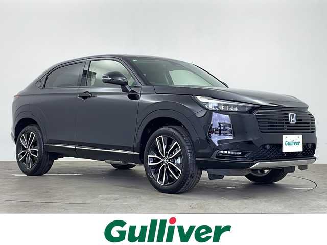 ホンダ ヴェゼル ハイブリッド e:HEV Z 鹿児島県 2025(令7)年 0.1千km クリスタルブラックパール 登録済未使用車/ホンダセンシング/純正ディスプレイオーディオ/(BT/Applecarplay/Androidauto/AM/FM/フルセグTV)/パドルシフト/レーダークルーズコントロール/レーンキープアシスト/純正ビルトインETC2.0/チップアップシート/ハーフレザーシート/前席シートヒーター/電動パワーバックドア/純正18インチアルミホイール/前後コーナーセンサー/オートマチックハイビーム/純正LEDヘッドライト/ブラインドスポットモニター/取扱説明書/保証書