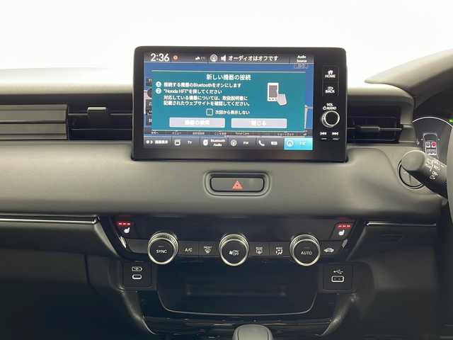 ホンダ ヴェゼル ハイブリッド e:HEV Z 鹿児島県 2025(令7)年 0.1千km クリスタルブラックパール 登録済未使用車/ホンダセンシング/純正ディスプレイオーディオ/(BT/Applecarplay/Androidauto/AM/FM/フルセグTV)/パドルシフト/レーダークルーズコントロール/レーンキープアシスト/純正ビルトインETC2.0/チップアップシート/ハーフレザーシート/前席シートヒーター/電動パワーバックドア/純正18インチアルミホイール/前後コーナーセンサー/オートマチックハイビーム/純正LEDヘッドライト/ブラインドスポットモニター/取扱説明書/保証書