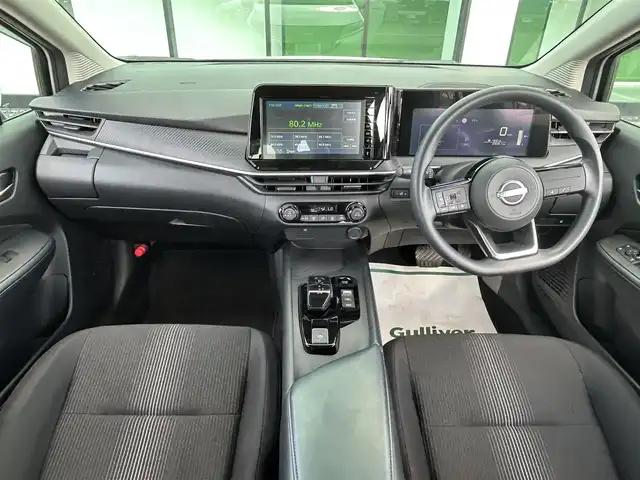 日産 ノート X 和歌山県 2023(令5)年 2.9万km ピュアホワイトパール 純正9インチディスプレイオーディオ/Bluetooth/USB/アラウンドビューモニター/ビルトインETC/前後ドライブレコーダー/デジタルインナーミラー/衝突軽減カメラ/BSM/コーナーセンサー/ステアリングスイッチ/電動パーキングブレーキ/オートブレーキホールド/ドライブモードセレクト/LEDヘッドライト/フォグランプ/オートライト/オートハイビーム/純正16インチAW/ドアバイザー/純正フロアマット/プッシュスタート/スマートキー/取扱説明書