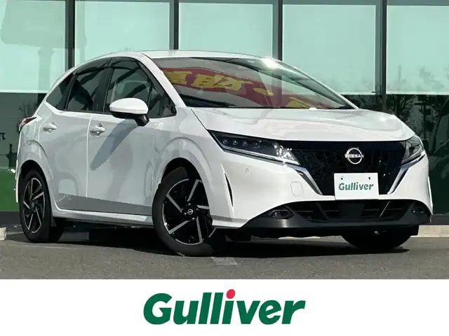 日産 ノート X 和歌山県 2023(令5)年 2.9万km ピュアホワイトパール 純正9インチディスプレイオーディオ/Bluetooth/USB/アラウンドビューモニター/ビルトインETC/前後ドライブレコーダー/デジタルインナーミラー/衝突軽減カメラ/BSM/コーナーセンサー/ステアリングスイッチ/電動パーキングブレーキ/オートブレーキホールド/ドライブモードセレクト/LEDヘッドライト/フォグランプ/オートライト/オートハイビーム/純正16インチAW/ドアバイザー/純正フロアマット/プッシュスタート/スマートキー/取扱説明書