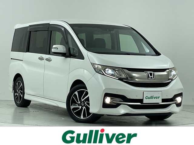 ホンダ ステップワゴン スパーダ クールスピリット 大阪府 2015(平27)年 6.9万km ホワイトオーキッドパール 禁煙車/ホンダセンシング/　・衝突軽減ブレーキ/　・誤発進抑制機能/　・歩行者事故軽減ステアリング/　・路外逸脱抑制機能/　・アダプティブ・クルーズ・コントロール/　・車線維持支援システム/　・先行車発進お知らせ機能/　・標識認識機能/純正ナビ/　（Bluetooth/CD/DVD）/フルセグTV/バックカメラ/両側パワースライドドア/ハーフレザーシート/シートヒーター/LEDヘッドライト/オートライト/フォグランプ/純正17インチアルミホイール/革巻きステアリング/スマートキー/ETC