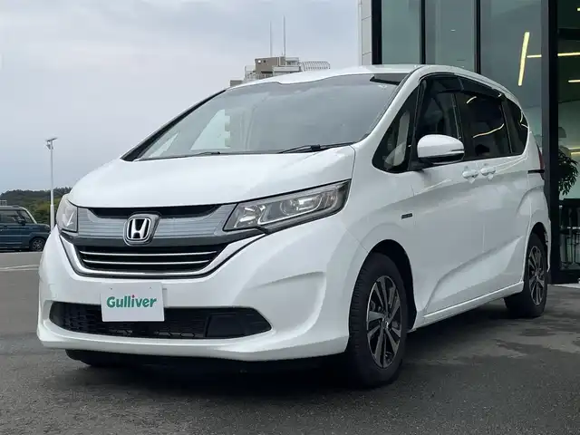 ホンダ フリード ハイブリット EX 東京都 2018(平30)年 7.7万km ホワイトオーキッドパール Honda SENSING/・衝突軽減ブレーキ/・誤発進抑制機能/・路外逸脱抑制機能/・アダプティブクルーズコントロール/・車線維持支援システム/・先行車発進お知らせ機能/プッシュスタート/寒冷地/コンフォートビューパッケージ/純正9インチナビ/フルセグTV/バックカメラ/ビルトインETC/ドライブレコーダー/両側パワースライドドア/ハーフレザーシート/シートヒーター/後席ロールサンシェード/LEDヘッドライト/ドアバイザー/スマートキー/15インチ純正アルミホイール