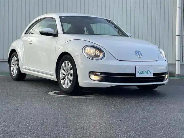 フォルクスワーゲン ザ・ビートル デザイン 富山県 2013(平25)年 7.5万km キャンディホワイト 〇純正ナビ/〇フルセグTV/〇ETC/〇横滑り防止装置/〇フロントフォグランプ/〇マニュアルエアコン/〇革巻きステアリングホイール/〇ブラックファブリックシート/〇純正16インチアルミホイール/〇リモコンキー/〇禁煙車