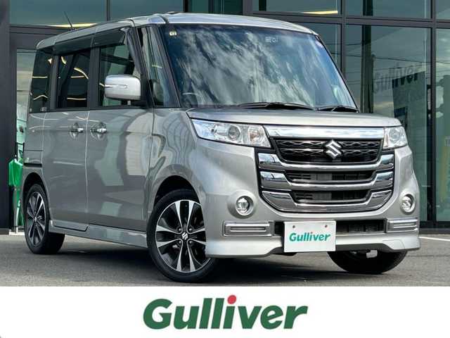 スズキ スペーシア カスタム Z ターボ 愛媛県 2016(平28)年 9.2万km スチールシルバーM 社外ナビ【KXM-E503W】/CD/DVD/Bluetooth/フルセグTV/バックカメラ/ビルトインETC/前後ドライブレコーダー/左側パワースライド/HIDヘッドライト/純正15インチAW /革巻きステアリング/ステアリングスイッチ/パドルシフト/電動格納ミラー/革調シートカバー/プッシュスタート