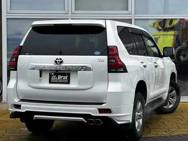 トヨタ ランドクルーザー プラド TX Lパッケージ 道北・旭川 2019(令1)年 8.1万km スーパーホワイトⅡ 純正9インチナビ/バックカメラ/フルセグTV/モデリスタエアロ/レザーシート/前席パワーシート/前席シートヒーター&クーラー/電動格納サードシート/LEDヘッドライト/プッシュスタート/スマートキー
