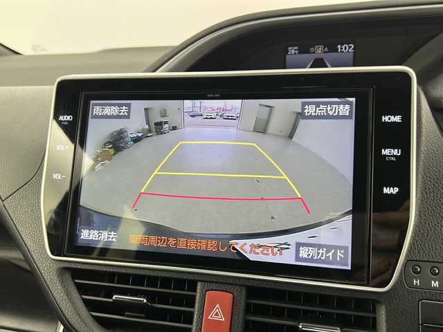 トヨタ ヴォクシー ZS 煌 宮城県 2018(平30)年 7.1万km ボルドーマイカメタリック Toyota Safety Sense /・プリクラッシュセーフティ/・レーンディパーチャーアラート/・オートマチックハイビーム/クルーズコントロール/純正10インチSDナビ/・BT.CD.DVD.USB.SD.HDMI/バックカメラ/フルセグTV/両側パワースライドドア/純正12.1インチフリップダウンモニター/ドライブレコーダー（F）/ビルトインETC/ステアリングスイッチ/LEDヘッドライト/LEDフォグライト/プッシュスタート/スマートキー/アイドリングストップ/社外フロアマット/純正16インチAW/ロールサンシェード/シートバックテーブル