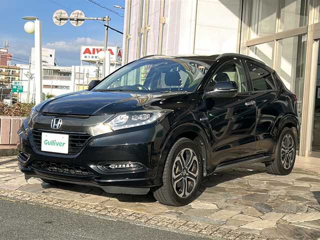 ホンダ ヴェゼル ハイブリッド Z ホンダセンシング 静岡県 2018(平30)年 7.2万km クリスタルブラックパール 社外ナビ（AM FM DTV Bluetooth SD DVD フルセグ USB ipod）/バックカメラ/アダプティブクルーズコントロール/ハーフレザーシート/シートヒーターD＋N席/チップアップシート/ドライブレコーダー/ヒーテッドドアミラー/ステアリングリモコンアダプター/ブレーキホールド/ETC/純正アルミホイール/社外フロアマット/LEDヘッドライト/フォグランプ/Wエアバッグ/カーテンエアバッグ/スマートキー/スペアキー×１/取扱説明書/保証書