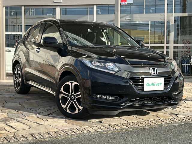 ホンダ ヴェゼル ハイブリッド Z ホンダセンシング 静岡県 2018(平30)年 7.2万km クリスタルブラックパール 社外ナビ（AM FM DTV Bluetooth SD DVD フルセグ USB ipod）/バックカメラ/アダプティブクルーズコントロール/ハーフレザーシート/シートヒーターD＋N席/チップアップシート/ドライブレコーダー/ヒーテッドドアミラー/ステアリングリモコンアダプター/ブレーキホールド/ETC/純正アルミホイール/社外フロアマット/LEDヘッドライト/フォグランプ/Wエアバッグ/カーテンエアバッグ/スマートキー/スペアキー×１/取扱説明書/保証書