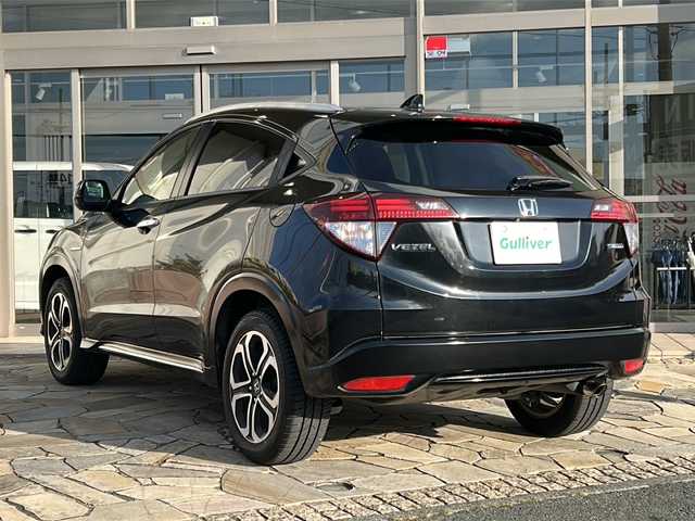 ホンダ ヴェゼル ハイブリッド Z ホンダセンシング 静岡県 2018(平30)年 7.2万km クリスタルブラックパール 社外ナビ（AM FM DTV Bluetooth SD DVD フルセグ USB ipod）/バックカメラ/アダプティブクルーズコントロール/ハーフレザーシート/シートヒーターD＋N席/チップアップシート/ドライブレコーダー/ヒーテッドドアミラー/ステアリングリモコンアダプター/ブレーキホールド/ETC/純正アルミホイール/社外フロアマット/LEDヘッドライト/フォグランプ/Wエアバッグ/カーテンエアバッグ/スマートキー/スペアキー×１/取扱説明書/保証書