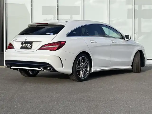 メルセデス・ベンツ ＣＬＡ１８０ Sブレイク AMG スタイル 福岡県 2018(平30)年 2.6万km カルサイトホワイト レーダーセーフティーパッケージ/純正ナビ/CD.DVD/フルセグTV/Bluetooth/バックカメラ/電動リアゲート/ブラインドスポットアシスト/パドルシフト/ACC/ブラックハーフレザーシート/シートヒーター（D/N席）/純正18インチAw/ACC/レーンキープアシスト