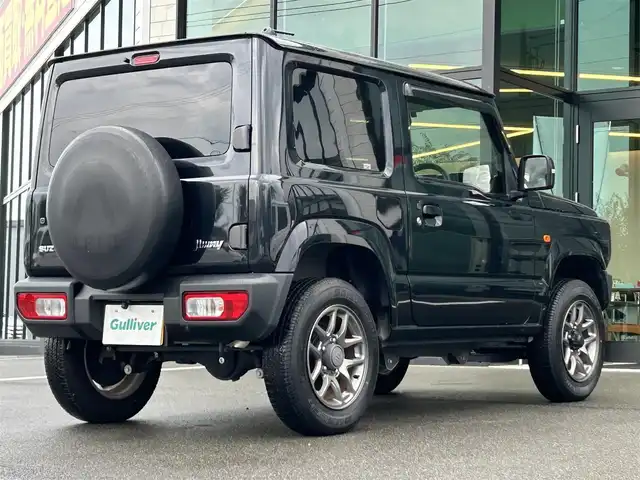スズキ ジムニー XC 愛媛県 2021(令3)年 1.5万km ブルーイッシュブラックパール3 1オーナー/純正7型ナビ(AM/FM/CD/DVD/BT/フルセグTV)/バックカメラ/クルーズコントロール/ドライブレコーダー/純正フロアマット/純正ドアバイザー/全席シートヒーター/ヒートミラー/電格ミラー/ヘッドライトウォッシャー/ETC/ISOFIX/シガーソケット/LEDヘッドライト/APIO背面タイヤカバー/現状サマー(純正AW)(175/80/R16)/BRIDGESTONE DUELER H/T 684II