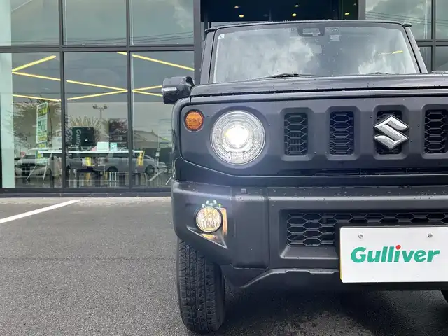 スズキ ジムニー XC 愛媛県 2021(令3)年 1.5万km ブルーイッシュブラックパール3 1オーナー/純正7型ナビ(AM/FM/CD/DVD/BT/フルセグTV)/バックカメラ/クルーズコントロール/ドライブレコーダー/純正フロアマット/純正ドアバイザー/全席シートヒーター/ヒートミラー/電格ミラー/ヘッドライトウォッシャー/ETC/ISOFIX/シガーソケット/LEDヘッドライト/APIO背面タイヤカバー/現状サマー(純正AW)(175/80/R16)/BRIDGESTONE DUELER H/T 684II