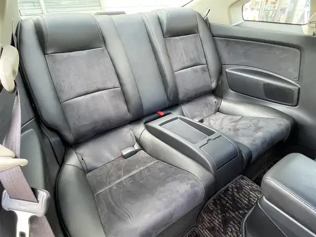 日産 スカイライン 350GT 福岡県 2005(平17)年 0.8万km スーパーブラック ワンオーナー/サンルーフ/フジツボマフラー/車高調/・インパルサスペンション/オートクチュール20インチアルミホイール/BOSEプレミアムサウンド/純正ナビ/　(AM/FM/CD)/横滑り防止/黒ハーフレザーシート/パワーシート(D/N)/革巻きステアリング/純正フロアマット/積載品/・オートクチュールグリル/スペアキー×1/アクセサリーソケット/保証書