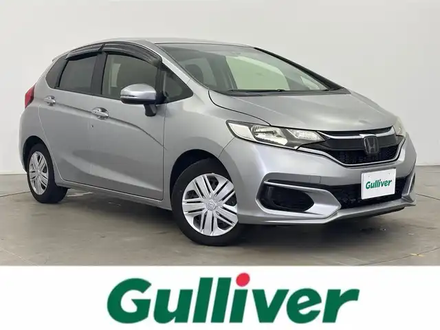 ホンダ フィット 13G F 富山県 2017(平29)年 1.1万km ルナシルバーM １オーナー/純正オーディオ（CD）/ホンダセンシング/ACC/CMBS（衝突軽減ブレーキ）/レーンキープアシストシステム/先行車発進お知らせ/スマートキー/プッシュスタート/横滑防止装置/純正マット・社外バイザー/保証書、取説/スペアキー