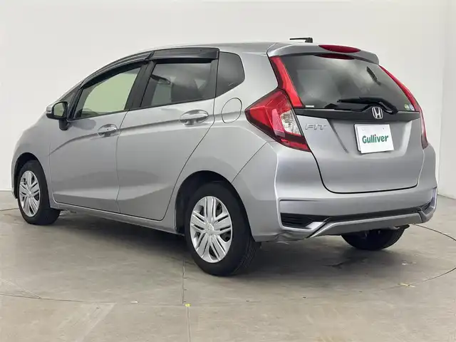 ホンダ フィット 13G F 富山県 2017(平29)年 1.1万km ルナシルバーM １オーナー/純正オーディオ（CD）/ホンダセンシング/ACC/CMBS（衝突軽減ブレーキ）/レーンキープアシストシステム/先行車発進お知らせ/スマートキー/プッシュスタート/横滑防止装置/純正マット・社外バイザー/保証書、取説/スペアキー