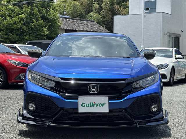 ホンダ シビック ハッチバック 熊本県 2019(平31)年 6.8万km ブリリアントスポーティブルーメタリック2トーン フルエアロ/純正ナビ（VXM-195VFi）/【フルセグTV/CD/DVD/Bluetooth/ラジオ】/バックカメラ/クルーズコントロール/パドルシフト/社外マフラー/社外足回り/前席シートヒーター/純正18インチAW/ビルトインETC/オートライト/LEDヘッドライト/フォグランプ/アイドリングストップ/ECON/横滑り防止機能/ブレーキホールド/社外フロアマット/革巻きステアリング/ステアリングスイッチ/保証書/取扱説明書