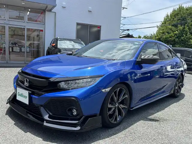 ホンダ シビック ハッチバック 熊本県 2019(平31)年 6.8万km ブリリアントスポーティブルーメタリック2トーン フルエアロ/純正ナビ（VXM-195VFi）/【フルセグTV/CD/DVD/Bluetooth/ラジオ】/バックカメラ/クルーズコントロール/パドルシフト/社外マフラー/社外足回り/前席シートヒーター/純正18インチAW/ビルトインETC/オートライト/LEDヘッドライト/フォグランプ/アイドリングストップ/ECON/横滑り防止機能/ブレーキホールド/社外フロアマット/革巻きステアリング/ステアリングスイッチ/保証書/取扱説明書