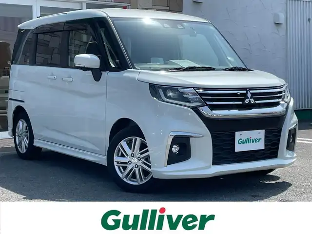 三菱 デリカＤ：２ ハイブリッドMZ ナビパッケージ 徳島県 2023(令5)年 1.3万km ピュアホワイトP 社外ナビ/プッシュスタート/バックカメラ/全方位カメラ/両側パワースライドドア/クルーズコントロール追従有/ヘッドアップディスプレイ/ETC/USB入力端子/前席シートヒーター/横滑り防止装置/コーナーセンサー/レーンキープアシスト/オートライト/LEDヘッドライト