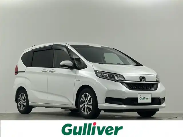 ホンダ フリード ハイブリット G ホンダセンシング 埼玉県 2021(令3)年 2万km プラチナホワイトパール Ｓパッケージ　１０．１型ナビ　両側パワースライド　ハーフレザーシート　シートヒーター　ＬＥＤヘッドライト　ビルトインＥＴＣ　寒冷地仕様　ドライブレコーダー前後　純正フロアマット　ワイパーデアイサー