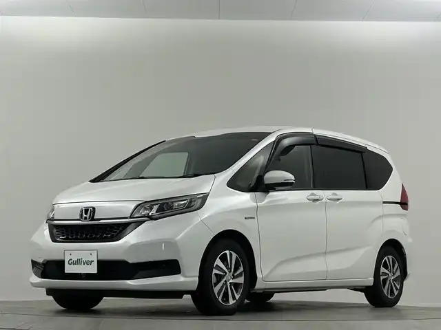 ホンダ フリード ハイブリット G ホンダセンシング 埼玉県 2021(令3)年 2万km プラチナホワイトパール Ｓパッケージ　１０．１型ナビ　両側パワースライド　ハーフレザーシート　シートヒーター　ＬＥＤヘッドライト　ビルトインＥＴＣ　寒冷地仕様　ドライブレコーダー前後　純正フロアマット　ワイパーデアイサー