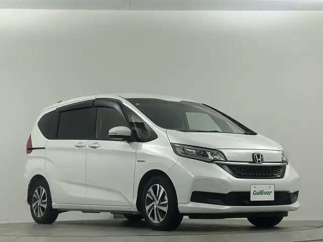 ホンダ フリード ハイブリット G ホンダセンシング 埼玉県 2021(令3)年 2万km プラチナホワイトパール Ｓパッケージ　１０．１型ナビ　両側パワースライド　ハーフレザーシート　シートヒーター　ＬＥＤヘッドライト　ビルトインＥＴＣ　寒冷地仕様　ドライブレコーダー前後　純正フロアマット　ワイパーデアイサー