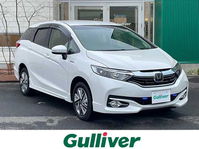 ホンダ シャトル ハイブリッド ホンダセンシング 青森県 2018(平30)年 11.1万km プラチナホワイトパール 4WD/社外メモリナビ/Bluetooth・SD・USB/バックカメラ/ホンダセンシング/衝突軽減ブレーキ/追従クルーズコントロール/路外逸脱抑制機能/誤発進抑制機能/ワイパーデアイサー/ビルトインETC/LEDヘッドライト/フォグランプ/スマートキー/プッシュスタート