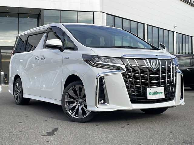 トヨタ アルファードハイブリット SR 青森県 2021(令3)年 6.1万km ホワイトパールクリスタルシャイン ・レザーシート/・純正ディスプレイオーディオ/・純正フリップダウンモニター/・DVD/フルセグ/Bluetooth/・バックカメラ/・ドライブレコーダー/・衝突被害軽減ブレーキ/・レーンキープアシスト/・レーダークルーズコントロール/・オートライト/・オートマチックハイビーム/・三眼LEDヘッドライト/・LEDフォグランプ/・パワーバックドア/・両側パワースライドドア/・シートヒーター/・横滑り防止装置/・純正フロアマット/・社外AW19インチ/・純正AW積込/・スペアタイヤ有り