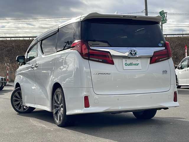 トヨタ アルファードハイブリット SR 青森県 2021(令3)年 6.1万km ホワイトパールクリスタルシャイン ・レザーシート/・純正ディスプレイオーディオ/・純正フリップダウンモニター/・DVD/フルセグ/Bluetooth/・バックカメラ/・ドライブレコーダー/・衝突被害軽減ブレーキ/・レーンキープアシスト/・レーダークルーズコントロール/・オートライト/・オートマチックハイビーム/・三眼LEDヘッドライト/・LEDフォグランプ/・パワーバックドア/・両側パワースライドドア/・シートヒーター/・横滑り防止装置/・純正フロアマット/・社外AW19インチ/・純正AW積込/・スペアタイヤ有り