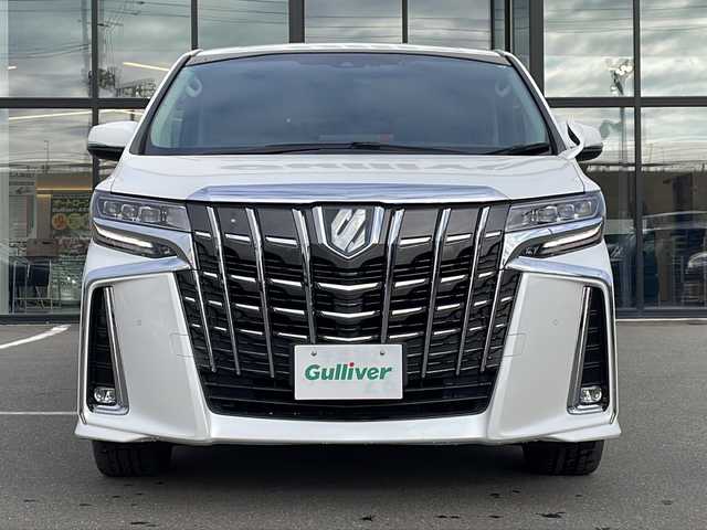 トヨタ アルファードハイブリット SR 青森県 2021(令3)年 6.1万km ホワイトパールクリスタルシャイン ・レザーシート/・純正ディスプレイオーディオ/・純正フリップダウンモニター/・DVD/フルセグ/Bluetooth/・バックカメラ/・ドライブレコーダー/・衝突被害軽減ブレーキ/・レーンキープアシスト/・レーダークルーズコントロール/・オートライト/・オートマチックハイビーム/・三眼LEDヘッドライト/・LEDフォグランプ/・パワーバックドア/・両側パワースライドドア/・シートヒーター/・横滑り防止装置/・純正フロアマット/・社外AW19インチ/・純正AW積込/・スペアタイヤ有り