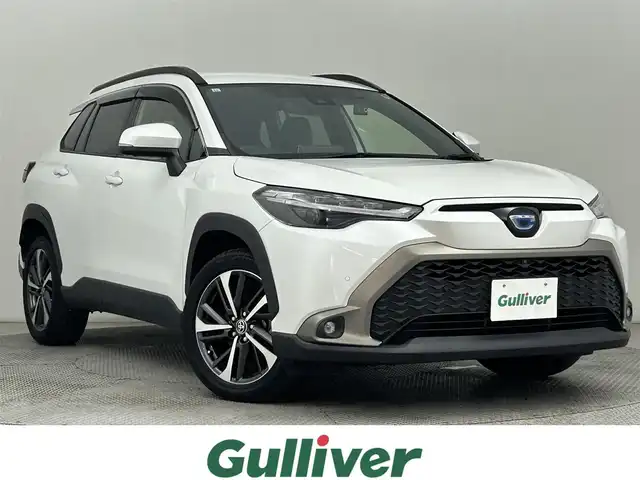 トヨタ カローラ クロス ハイブリッド Z 道央・札幌 2021(令3)年 4.2万km プラチナホワイトパールマイカ ・ワンオーナー/・４WD/・純正８型ディスプレイオーディオ/・BT/USB/AppleCarplay/フルセグTV/・パノラミックビューモニター/・ビルトインETC/・ドライブレコーダー前後（DC-DR652）/・トヨタセーフティセンス/・プリクラッシュセーフティ/・レーダークルーズコントロール/・レーントレーシングアシスト/・ロードサインアシスト/・ドライバー異常時対応システム/・プロアクティブドライビングシステム/・パーキングサポートブレーキ/・オートブレーキホールド/・クリアランスソナー/・ブライドスポットモニター/・横滑り防止装置/・アイドリングストップ/・オートマチックハイビーム/・オートライト/・ヘッドランプレベライザー/・LEDヘッドライト/・LEDフォグランプ/・ハーフレザーシート/・D＋N席シートヒーター/・純正１８インチAW/・純正フロアマット/・プッシュスタート/・スマートキー/・取扱説明書/・保証書