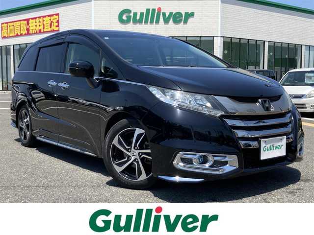 ホンダ オデッセイ アブソルート 鳥取県 2015(平27)年 5.1万km クリスタルブラックパール 純正8インチナビ/フルセグ/CD/DVD/BT/HDMI/バックカメラ・ビルトインETC/純正11インチフリップダウンモニター/ホンダセンシング/レーダークルーズコントロール/レーンキープアシスト/両側パワースライドドア/ハーフレザーシート/LEDヘットライト/純正17インチアルミホイール/プッシュエンジンスタート/アイドリングストップ/純正フロアマット/ドアバイザー/保証書・取扱説明書