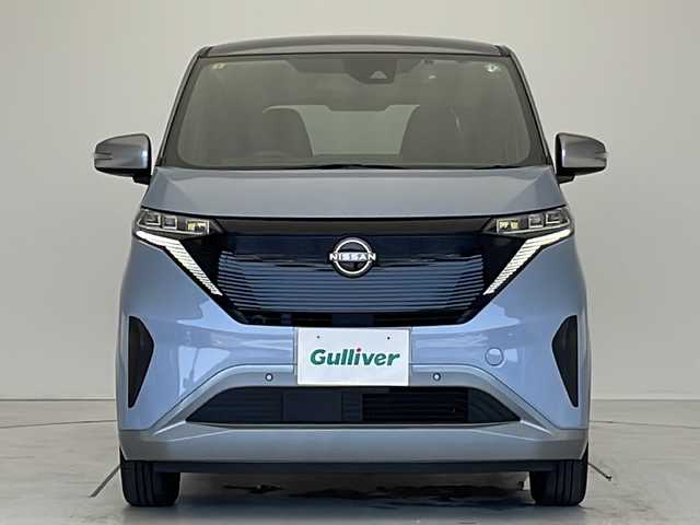 日産 サクラ X 愛知県 2023(令5)年 1.3万km 青 衝突被害軽減ブレーキ/純正9インチディスプレイオーディオ（ナビ無し）/Bluetooth/コーナーセンサー/純正アルミホイール/LEDヘッドライト/ドライブレコーダー/ステアリングスイッチ/スマートキー/プッシュスタート