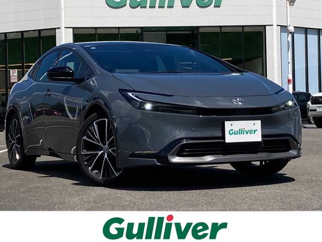 トヨタ プリウス Z 佐賀県 2023(令5)年 1.4万km グレー パノラマルーフ/純正12.3インチディスプレイオーディオ/ナビキット/パノラマミックビューモニター/プリクラッシュセーフティ/レーンディパーチャーアラート/オートハイビーム/アダプティブクルーズコントロール/クリアランスソナー/ブラインドスポットモニター/リアクロストラフィックアラート/パーキングアシスト/レザーシート/メモリパワーシートシート/シートヒーター/エアシート/ステアリングヒーター/ステアリングリモコン/パワートランク/スマートルーミラー/電動パーキングブレーキ/オートブレーキホールド/AC100V/プッシュスタート/スマートキー/LEDヘッドライト/純正19インチアルミホイール/ボディカラー:アッシュ〈1M2〉