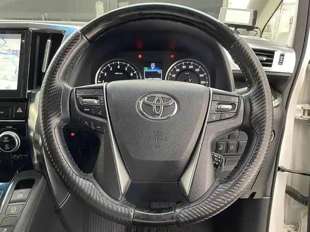 トヨタ ヴェルファイア Z Gエディション 滋賀県 2016(平28)年 6.7万km ホワイトパールクリスタルシャイン 純正10型ナビ/CD/DVD/Bluetooth/ETC/フリップダウンモニター/バックカメラ/電動パーキング/フルセグTV/パワーバックドア/ハンドルヒーター/クルーズコントロール/ハーフレザーシート/トヨタセーフティセンス/両側電動スライドドア/パワーシート/LEDヘッドライト
