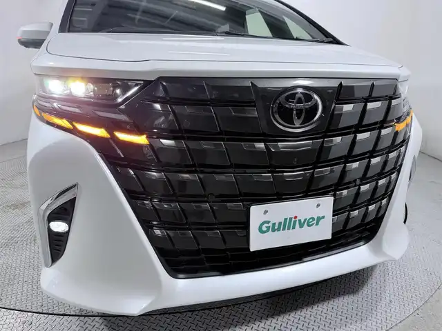 トヨタ アルファードハイブリット Z 大阪府 2024(令6)年 0.8万km プラチナホワイトパールマイカ サンルーフ トヨタチームメイト 衝突軽減B 360カメラ 後席モニター レーダークルーズC ハンドルヒーター 両側電動ドア パワーバックドア AC100V BSM ドラレコ プッシュスタート ETC