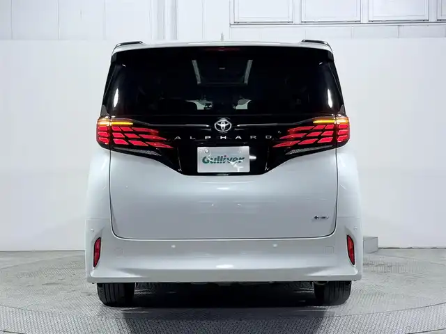 トヨタ アルファードハイブリット Z 大阪府 2024(令6)年 0.8万km プラチナホワイトパールマイカ サンルーフ トヨタチームメイト 衝突軽減B 360カメラ 後席モニター レーダークルーズC ハンドルヒーター 両側電動ドア パワーバックドア AC100V BSM ドラレコ プッシュスタート ETC