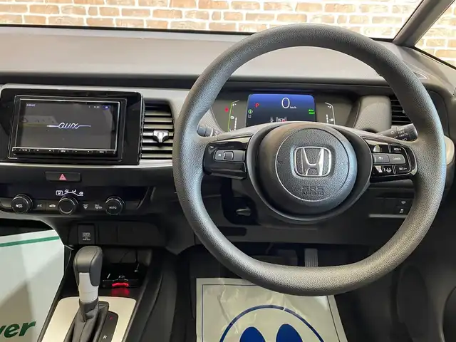 ホンダ フィット e:HEVベーシック 長野県 2023(令5)年 5.5万km クリスタルブラックパール ・4WD/Honda SENSING/・衝突軽減ブレーキ（CMBS）/・先行車発進お知らせ機能/・アダプティブクルーズコントロール/・車線維持支援システム（LKAS）/・ブラインドスポットインフォメーション/・社外ナビ/・Bluetooth/バックカメラ/・コンフォートパッケージ/・オートホールド/・ETC/・ビークルスタビリティアシスト/・オートライト/LEDライト/・横滑り防止