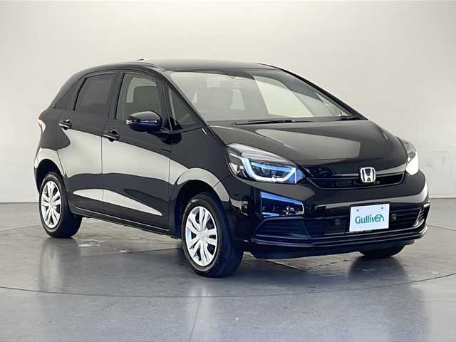 ホンダ フィット e:HEVベーシック 長野県 2023(令5)年 5.5万km クリスタルブラックパール 4WD/社外ナビ（FM/AM/Bluetooth/DISC/USB）/ホンダセンシング/・路外逸脱抑制機能/・踏み間違い衝突軽減システム/・パーキングセンサー警報/・衝突軽減ブレーキ/・先行車発進お知らせ機能/・標識認識機能/・パーキングセンサー/プッシュスタート/アイドリングストップ/スマートキー/AACエアコン/追従機能付きクルコン/ABS/横滑り防止装置/オートハイビーム/LEDヘッドライト/フロントガラス熱線/ドアミラーヒーター/電子パーキングブレーキ/オートブレーキホールド/ヘッドライトレベライザー/純正フロアマット/純正ホイールキャップ付きスチールホイール/保証書/取扱説明書