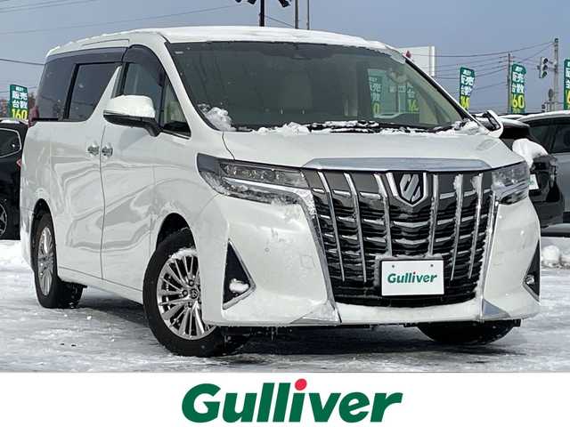 トヨタ アルファード G 道央・札幌 2018(平30)年 4.2万km ホワイトパールクリスタルシャイン ４WD/純正ディーラーOPナビ/CD/DVD/BT/フルセグ/トヨタセーフティセンス/プリクラッシュセーフティ/横滑り防止装置/レーダークルーズコントロール/レーンキープアシスト/クリアランスソナー/ブラインドスポットモニター/パーキングサポートブレーキ/ロードサインアシスト/バックカメラ/ビルトインETC/ドライブレコーダー/アイドリングストップ/ECOMODE/デジタルインナーミラー/両側パワースライドドア/パワーバックドア/前席/２列目パワーシート/D席メモリーシート/前席シートヒーター/前席エアシート/N席/２列目オットマン/レザーシート/革巻きウッドコンビステアリング/ステアリングリモコン/電動パーキング/ブレーキホールド/MTモード付AT/プッシュスタート/スマートキー/LEDヘッドライト/オートライト/オートハイビーム/フォグランプ/電動格納ミラー/ウィンカーミラー/純正フロアマット/ドアバイザー