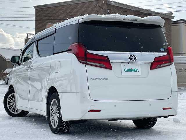 トヨタ アルファード G 道央・札幌 2018(平30)年 4.2万km ホワイトパールクリスタルシャイン ４WD/純正ディーラーOPナビ/CD/DVD/BT/フルセグ/トヨタセーフティセンス/プリクラッシュセーフティ/横滑り防止装置/レーダークルーズコントロール/レーンキープアシスト/クリアランスソナー/ブラインドスポットモニター/パーキングサポートブレーキ/ロードサインアシスト/バックカメラ/ビルトインETC/ドライブレコーダー/アイドリングストップ/ECOMODE/デジタルインナーミラー/両側パワースライドドア/パワーバックドア/前席/２列目パワーシート/D席メモリーシート/前席シートヒーター/前席エアシート/N席/２列目オットマン/レザーシート/革巻きウッドコンビステアリング/ステアリングリモコン/電動パーキング/ブレーキホールド/MTモード付AT/プッシュスタート/スマートキー/LEDヘッドライト/オートライト/オートハイビーム/フォグランプ/電動格納ミラー/ウィンカーミラー/純正フロアマット/ドアバイザー