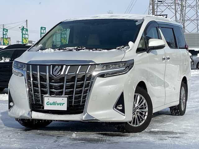 トヨタ アルファード G 道央・札幌 2018(平30)年 4.2万km ホワイトパールクリスタルシャイン ４WD/純正ディーラーOPナビ/CD/DVD/BT/フルセグ/トヨタセーフティセンス/プリクラッシュセーフティ/横滑り防止装置/レーダークルーズコントロール/レーンキープアシスト/クリアランスソナー/ブラインドスポットモニター/パーキングサポートブレーキ/ロードサインアシスト/バックカメラ/ビルトインETC/ドライブレコーダー/アイドリングストップ/ECOMODE/デジタルインナーミラー/両側パワースライドドア/パワーバックドア/前席/２列目パワーシート/D席メモリーシート/前席シートヒーター/前席エアシート/N席/２列目オットマン/レザーシート/革巻きウッドコンビステアリング/ステアリングリモコン/電動パーキング/ブレーキホールド/MTモード付AT/プッシュスタート/スマートキー/LEDヘッドライト/オートライト/オートハイビーム/フォグランプ/電動格納ミラー/ウィンカーミラー/純正フロアマット/ドアバイザー