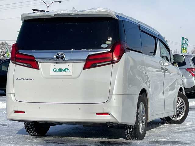 トヨタ アルファード G 道央・札幌 2018(平30)年 4.2万km ホワイトパールクリスタルシャイン ４WD/純正ディーラーOPナビ/CD/DVD/BT/フルセグ/トヨタセーフティセンス/プリクラッシュセーフティ/横滑り防止装置/レーダークルーズコントロール/レーンキープアシスト/クリアランスソナー/ブラインドスポットモニター/パーキングサポートブレーキ/ロードサインアシスト/バックカメラ/ビルトインETC/ドライブレコーダー/アイドリングストップ/ECOMODE/デジタルインナーミラー/両側パワースライドドア/パワーバックドア/前席/２列目パワーシート/D席メモリーシート/前席シートヒーター/前席エアシート/N席/２列目オットマン/レザーシート/革巻きウッドコンビステアリング/ステアリングリモコン/電動パーキング/ブレーキホールド/MTモード付AT/プッシュスタート/スマートキー/LEDヘッドライト/オートライト/オートハイビーム/フォグランプ/電動格納ミラー/ウィンカーミラー/純正フロアマット/ドアバイザー