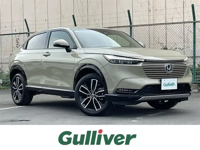 ホンダ ヴェゼル ハイブリッド e:HEV Z 東京都 2024(令6)年 0.6万km サンドカーキパール 純正コネクトナビ/バックモニター/衝突被害軽減/路外逸脱抑制/アダプティブクルーズコントロール/ソナー/ＥＴＣ/シートヒーター/ステアリングスイッチ/横滑り防止措置/スマートキー/電動リアゲート