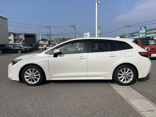 トヨタ カローラツーリング ハイブリッド S 石川県 2019(令1)年 8.4万km ホワイトパールクリスタルシャイン 4WD/純正ディスプレイオーディオ/ナビ/バックカメラ/トヨタセーフティセンス/レーダークルーズ/ETC/シートヒーター/ハンドルヒーター/純正アルミホイール/スマートキー/プッシュスタート/LEDヘッドライト/AC100V