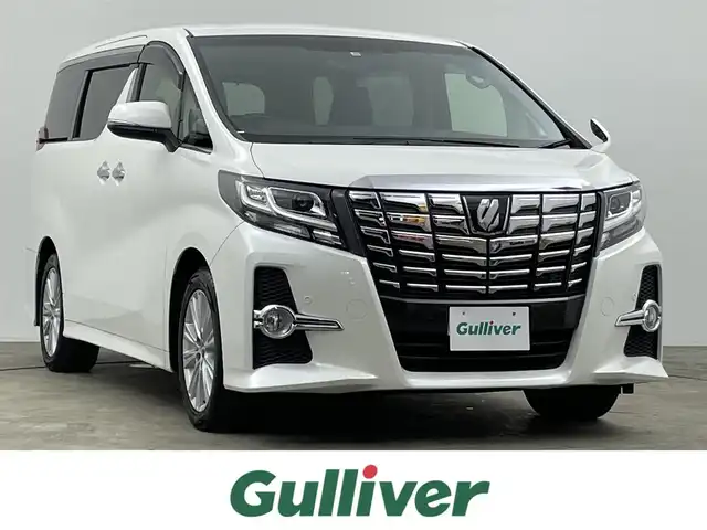 トヨタ アルファード S 千葉県 2015(平27)年 3.7万km ホワイトパールクリスタルシャイン 禁煙車/クリアランスソナー/クルーズコントロール/片側パワースライドドア/アルパイン１２.８型フリップダウンモニター/純正９型メモリナビ/・型番：NSZT-Y64T/・CD/DVD/Bluetooth/フルセグTV/・バックカメラ/・ビルトインETC/革巻きステアリング/・ステアリングスイッチ/MT付きAT/レザー風シートカバー/電子パーキング/・ブレーキホールド/社外フロアマット/純正１８インチAW/オートライト/・LEDヘッドライト/・フォグランプ
