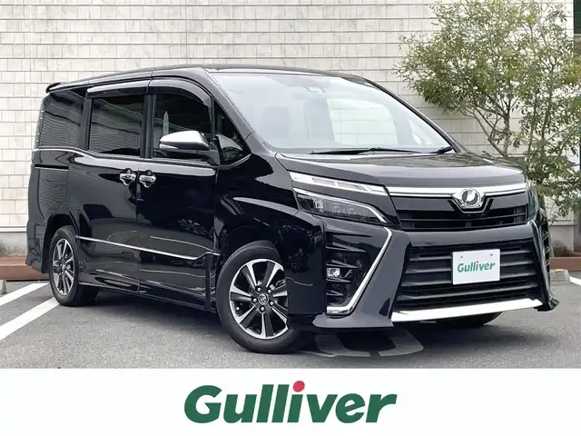 トヨタ ヴォクシー ZS 煌 愛媛県 2018(平30)年 3.5万km ブラック 純正10インチメーカーナビ/フリップダウンモニター/・Bluetooth/・CD/DVD/ワンセグTV/バックカメラ/ETC/3列シート/両側パワースライドドア/純正フロアマット/純正16インチAW/衝突軽減システム/レーンキープアシスト/オートマチックハイビーム/LEDヘッドライト/アイドリングストップ/スマートキー/スペアキー/取扱説明書