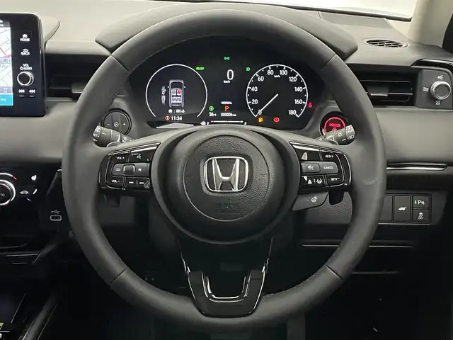 ホンダ ヴェゼル ハイブリッド e:HEV Z 愛知県 2025(令7)年 0.1千km クリスタルブラックパール 登録済未使用車/純正9型ナビ/Bluetooth/フルセグTV/ETC2.0/バックカメラ/BSM/パワーバックドア/ステアリングヒーター/前席シートヒーター/ワイヤレス充電/LEDヘッドライト/追従クルーズコントロール/禁煙車/ホンダセンシング/後退出庫サポート/e:HEV Z　3VC4AZ　Honda CONNECTディスプレー+ETC2.0車載器+ワイヤレス充電器(220/000)