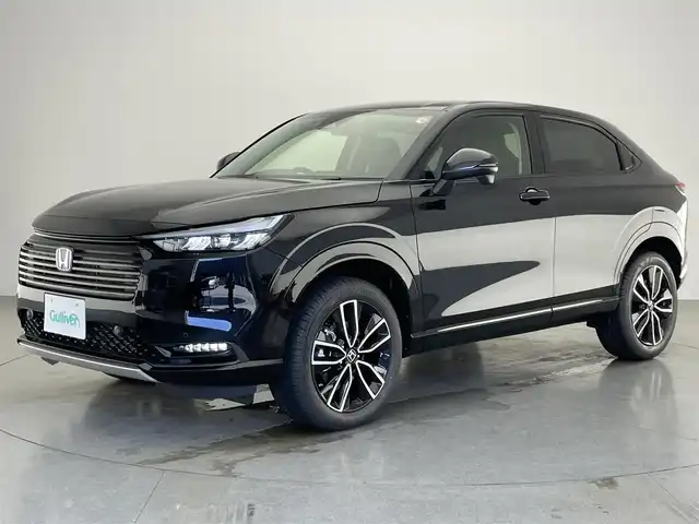 ホンダ ヴェゼル ハイブリッド e:HEV Z 愛知県 2025(令7)年 0.1千km クリスタルブラックパール 登録済未使用車/純正9型ナビ/Bluetooth/フルセグTV/ETC2.0/バックカメラ/BSM/パワーバックドア/ステアリングヒーター/前席シートヒーター/ワイヤレス充電/LEDヘッドライト/追従クルーズコントロール/禁煙車/ホンダセンシング/後退出庫サポート/e:HEV Z　3VC4AZ　Honda CONNECTディスプレー+ETC2.0車載器+ワイヤレス充電器(220/000)